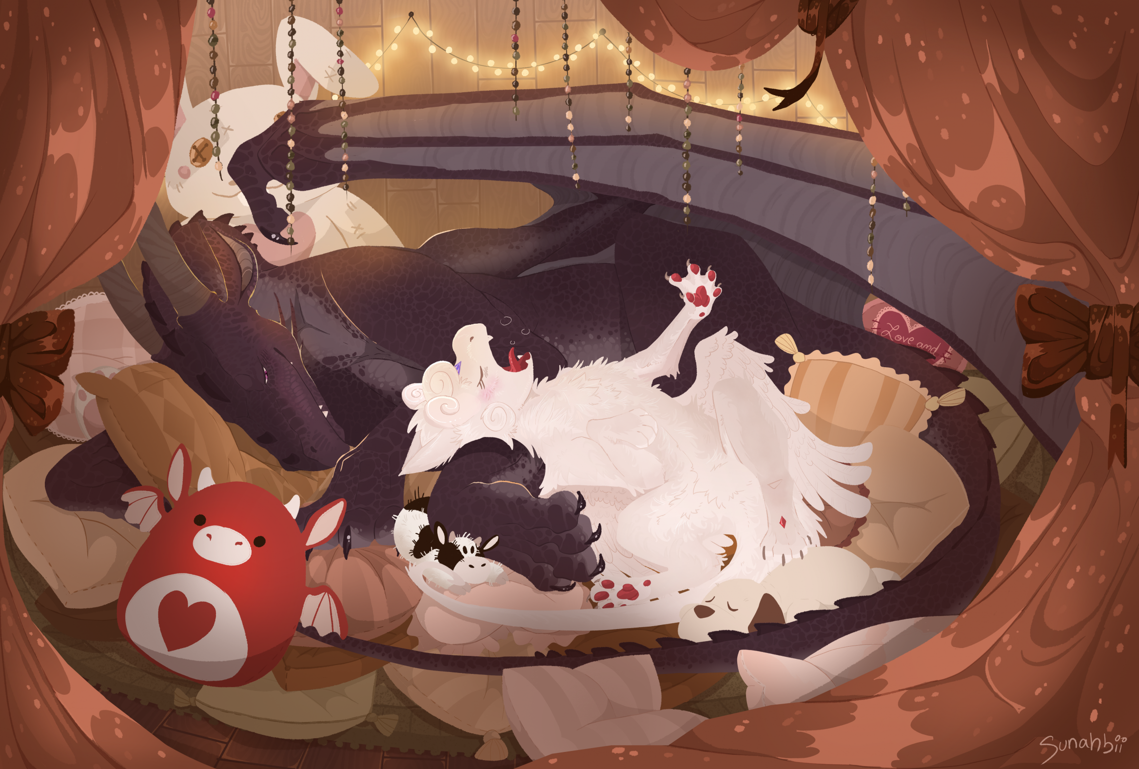 Two dragons cozying up to each other on a pillow pile